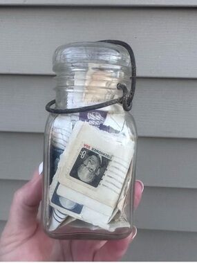 Vintage jar of postage stamps
